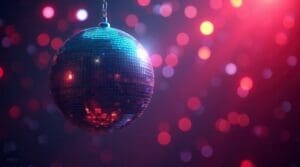 Mirrorball reflecting purple and pink lights on a wall with bokeh effect